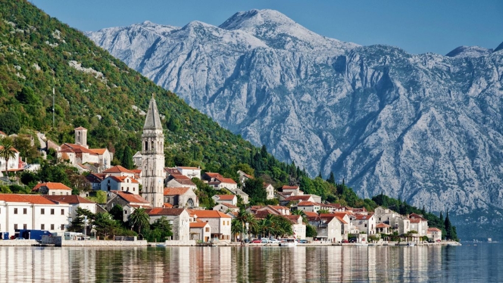 coastal town view promoting property for sale in montenegro