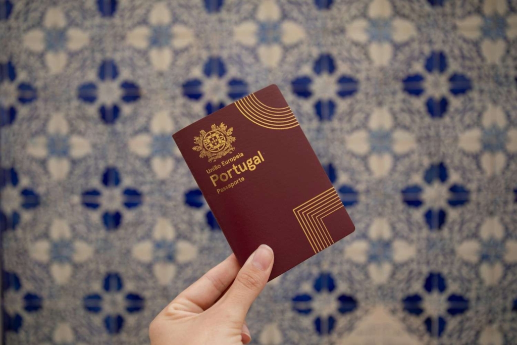 woman holding portugal passport