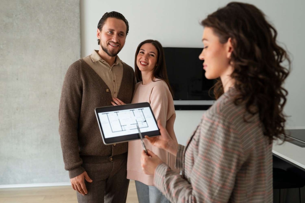 agent showing plans to buyers during international real estate marketing in bali