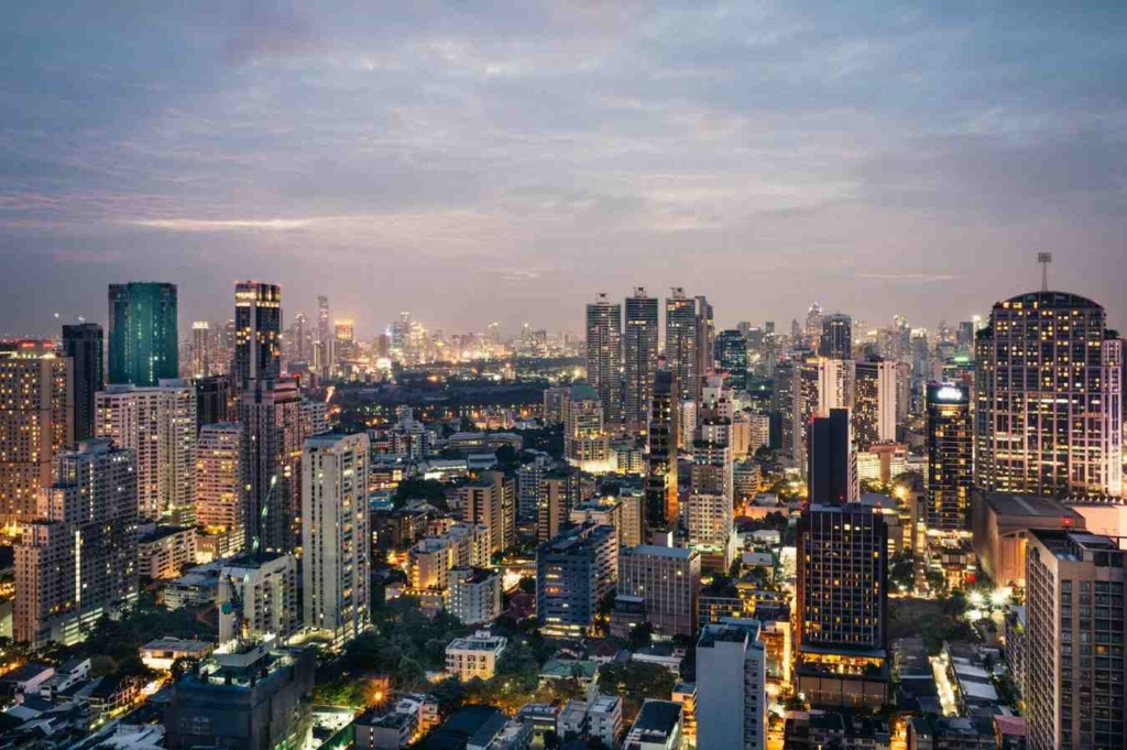 bangkok city skyline at night, illustrating international property marketing in thailand.
