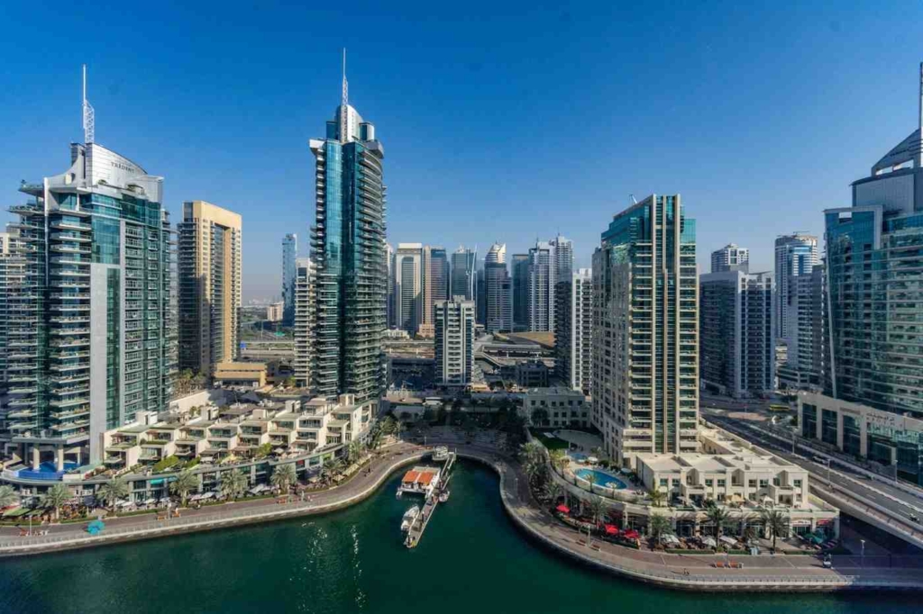 dubai marina skyline with waterfront towers.
