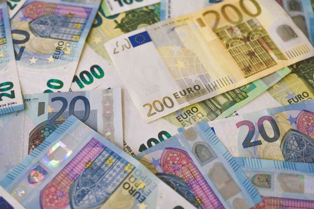 euro banknotes highlighting costs when asking can foreigners buy property in portugal
