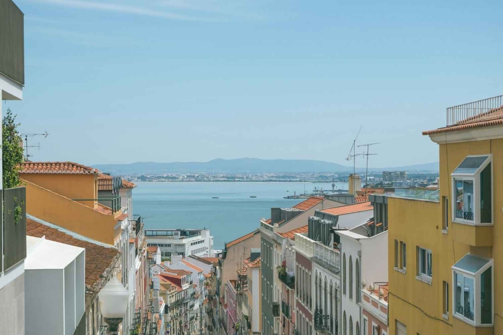 lisbon homes overlooking the water, highlighting scenic areas tied to the benefits of buying property in portugal.