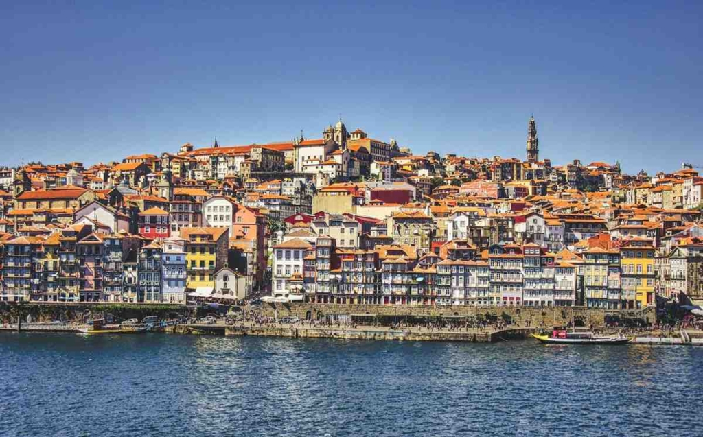 porto city skyline in portugal with colorful historic buildings along the douro river.