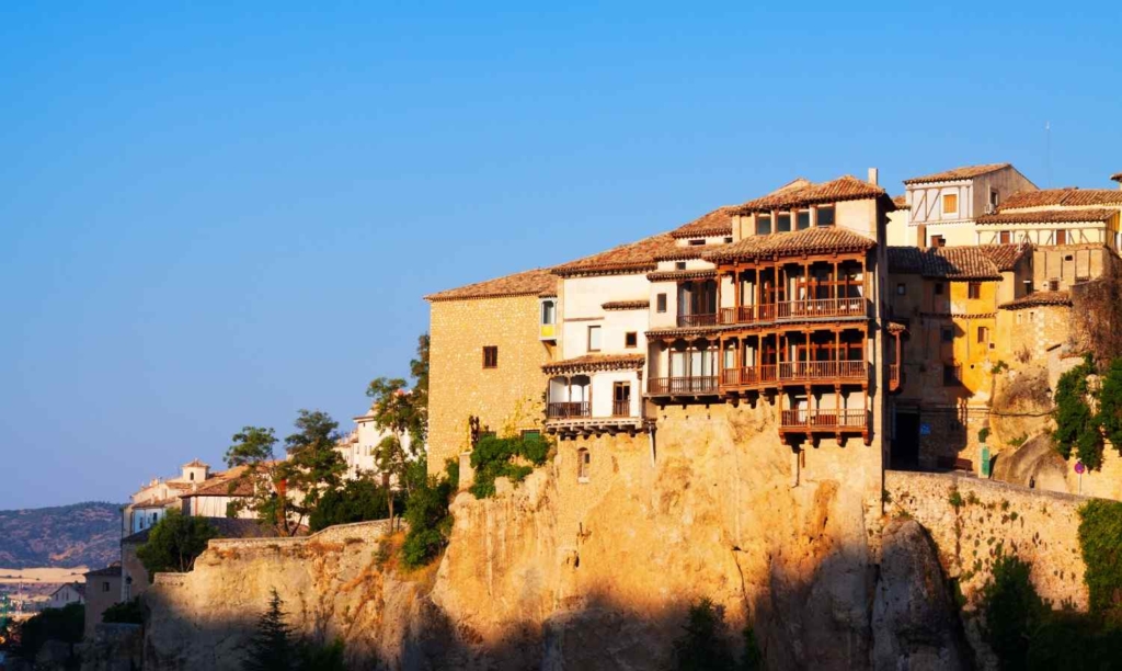 cliffside homes and coastal town views for buying property in greece