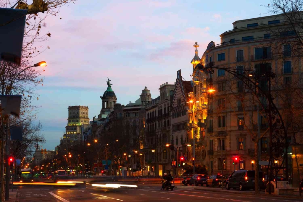 barcelona street at dusk, one of the cheapest cities to live in europe.