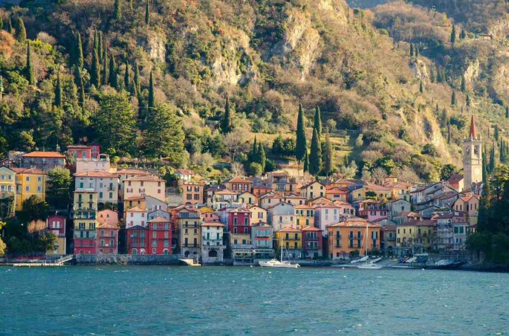 colorful lakeside village in lombardy, reflecting average house price in italy.