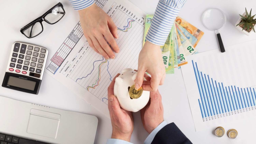 saving money for porto, portugal housing with piggy bank and charts