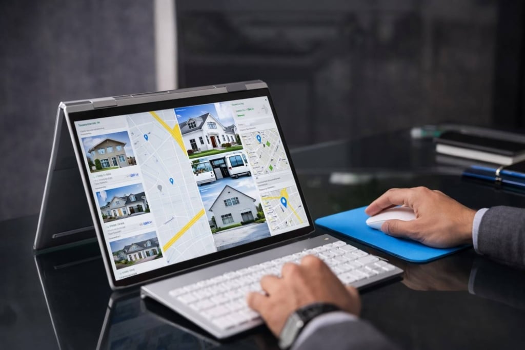 real estate content marketing shown on a laptop with property listings and maps.