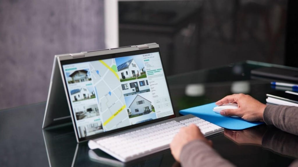 real estate project marketing content on a laptop screen.