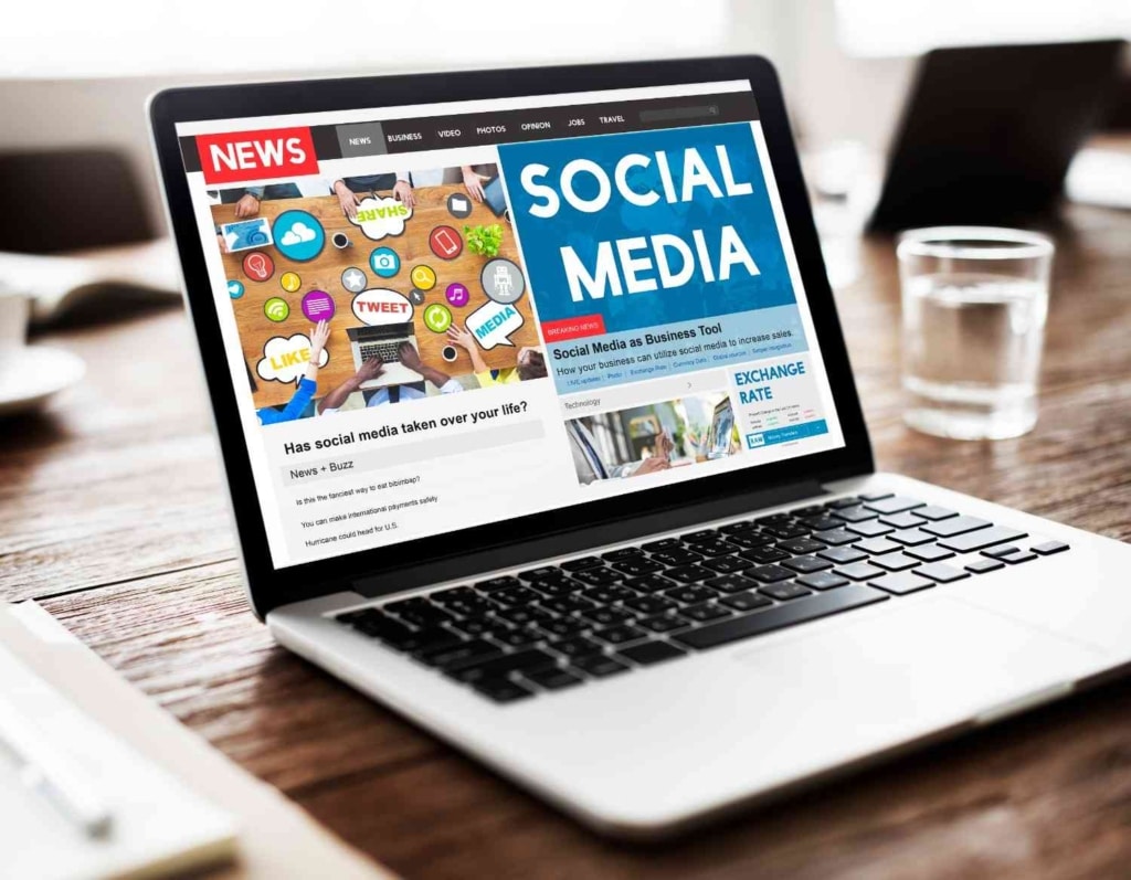 laptop showing real estate social media content for online property marketing.