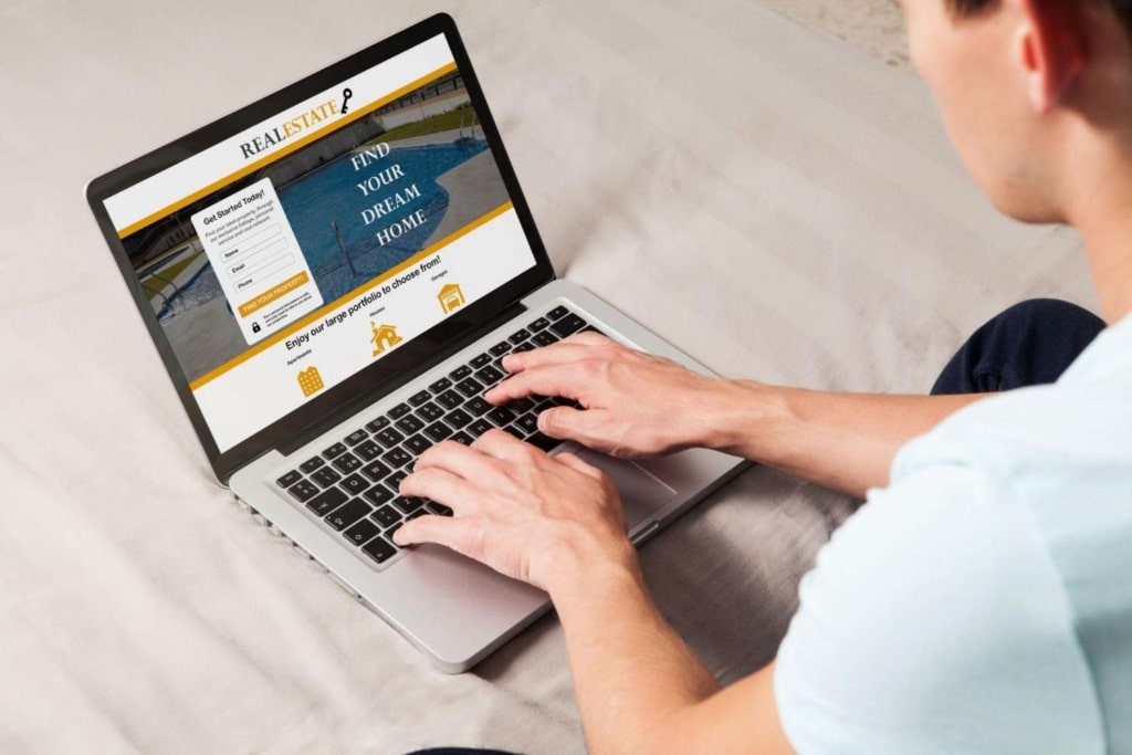 writing real estate listing marketing copy on a laptop for property listings online.